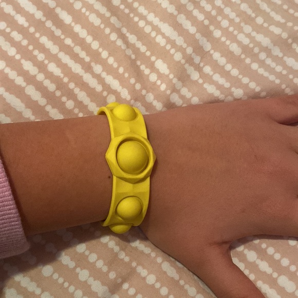 Three pop it bracelets. Good pops. One yellow one rainbow and one multi colored - Picture 3 of 4